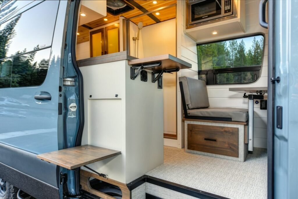Interior of a camper van set up for overnight camping