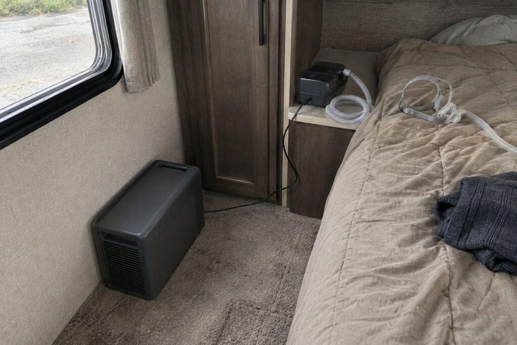 Portable power station on an RV bedroom floor powering a CPAP