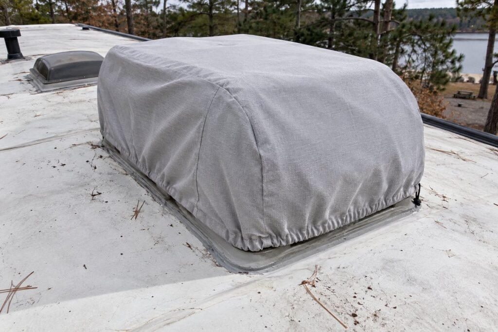RV air conditioner cover fitted and cinched over a rooftop AC unit